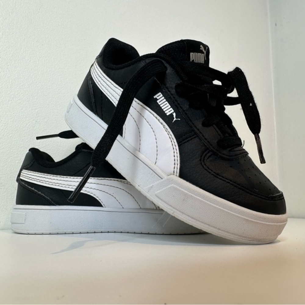 PUMA Unisex-Child Caven Sneaker, Black/White size 12C
